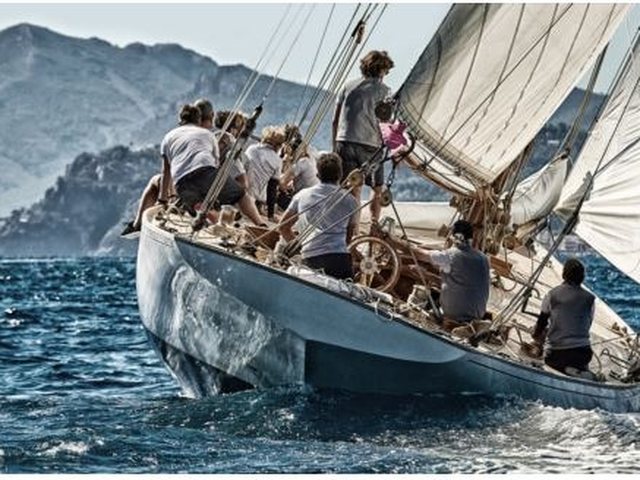 Sailors aboard a classic racing yacht