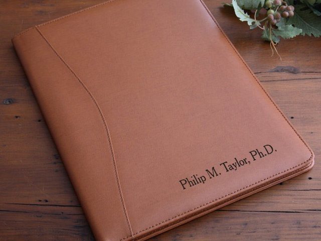 Tan leather executive portfolio engraved with a name