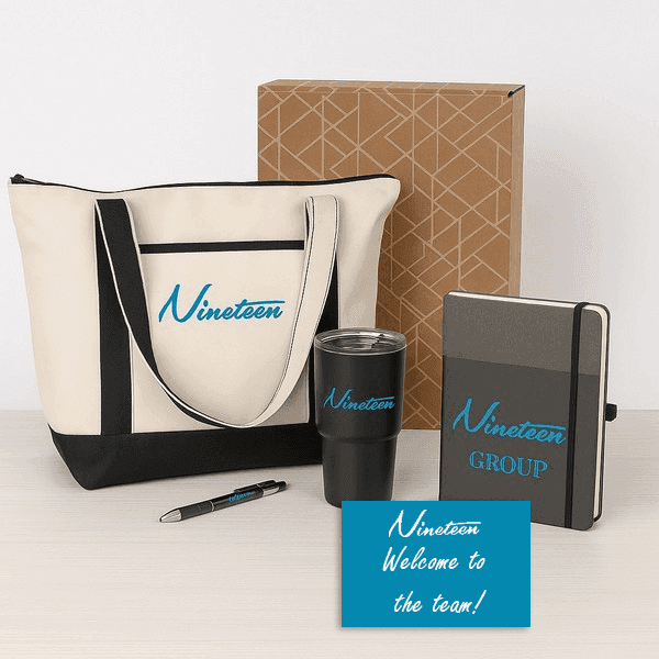 Nineteen Group new hire gift set with branded tote, journal, tumbler, pen, and welcome card