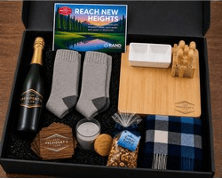 Rand Presidents Club VIP appreciation kit with lake and lodge themed contents